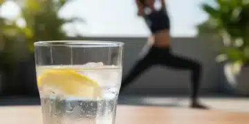 Optimal Hydration Habits: Why 60% of Americans Miss Out and How to Improve Glass of water with lemon on a table, symbolizing healthy hydration